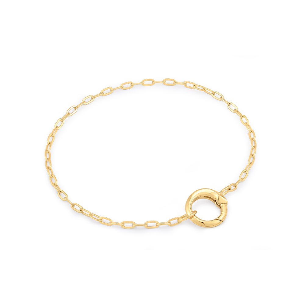 A gold-plated link bracelet with a ring able to hold charms
