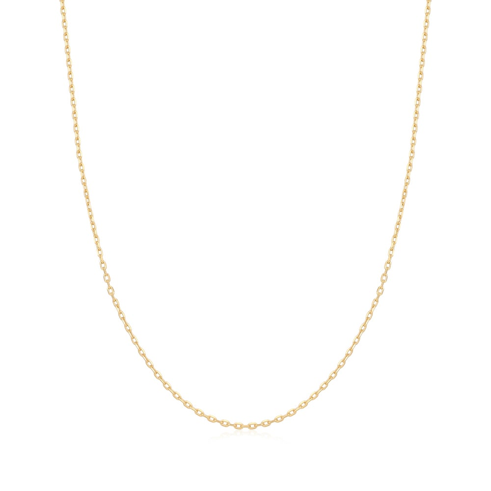 A gold-plated mini link chain necklace set against a white background. From the Pop Charms Collection by Ania Haie