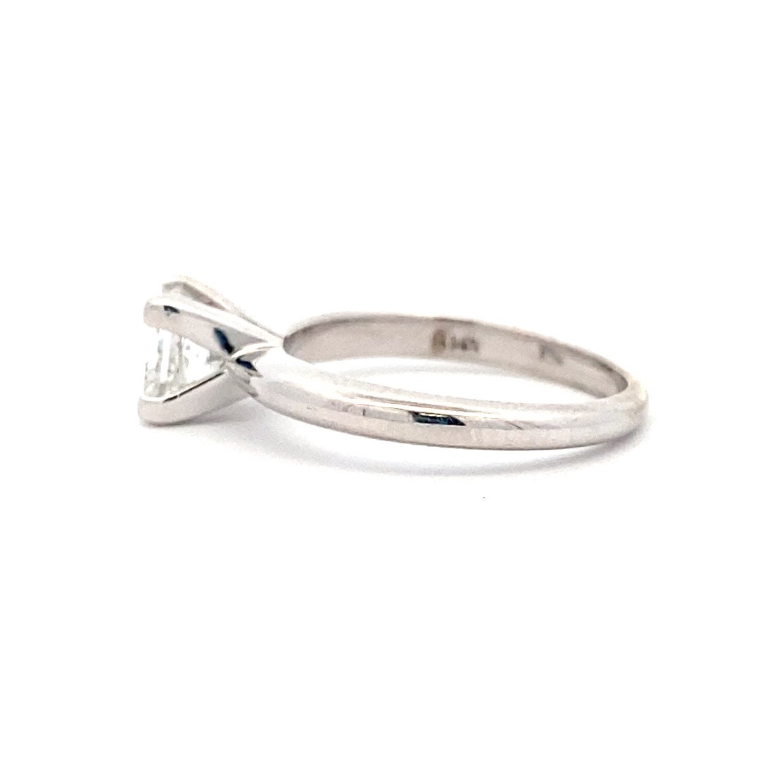 An estate white gold solitaire-style ring with a square-shaped modern brilliant diamond