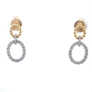 A pair of oval front hoop earrings set with diamonds in two-tone gold