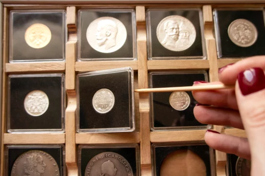 A collection of gold coins and silver coins
