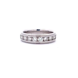 One 14 karat white gold diamond channel band with 11 round brilliant diamonds weighing 1.00 carats total weight with G-H color and SI2 clarity in a channel setting with milgrain accents on both edges.