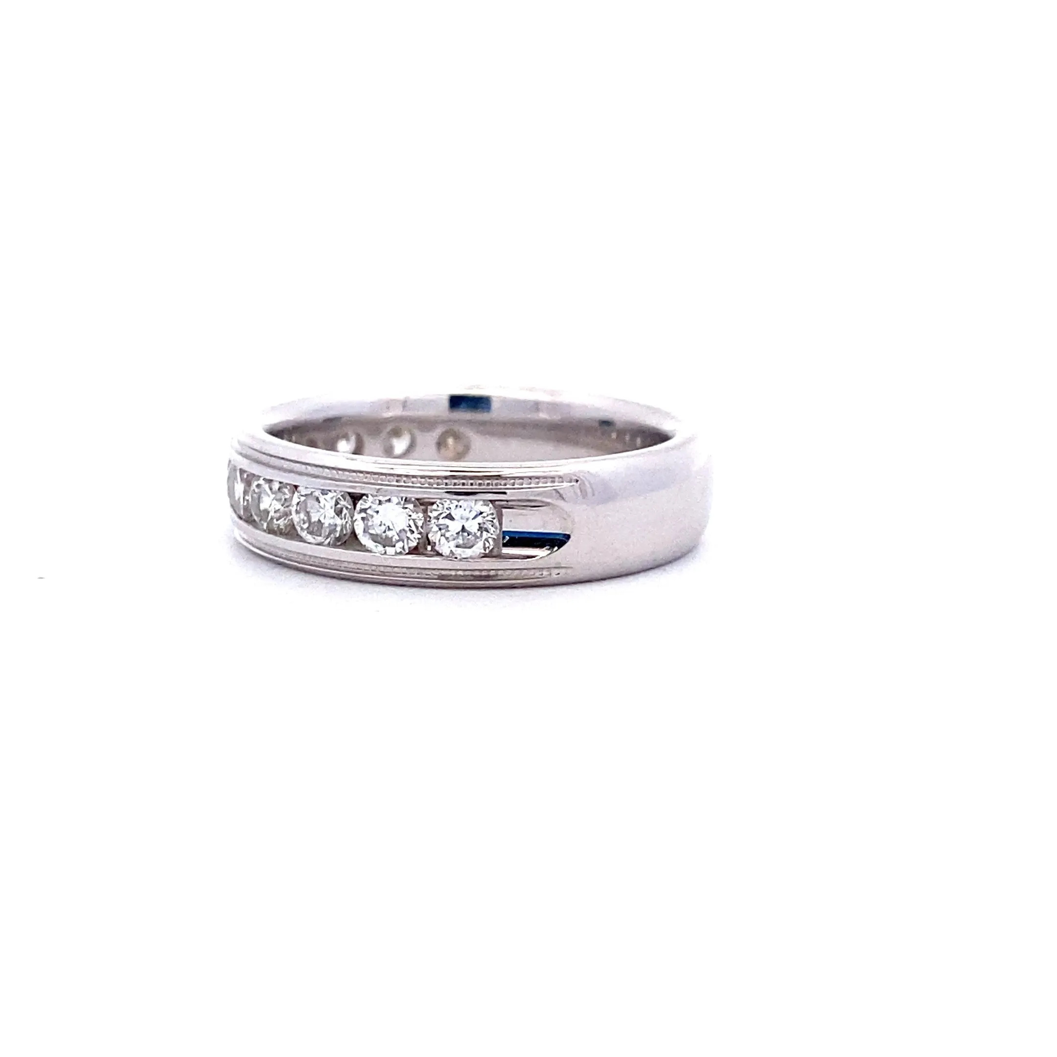 One 14 karat white gold diamond channel band with 11 round brilliant diamonds weighing 1.00 carats total weight with G-H color and SI2 clarity in a channel setting with milgrain accents on both edges.