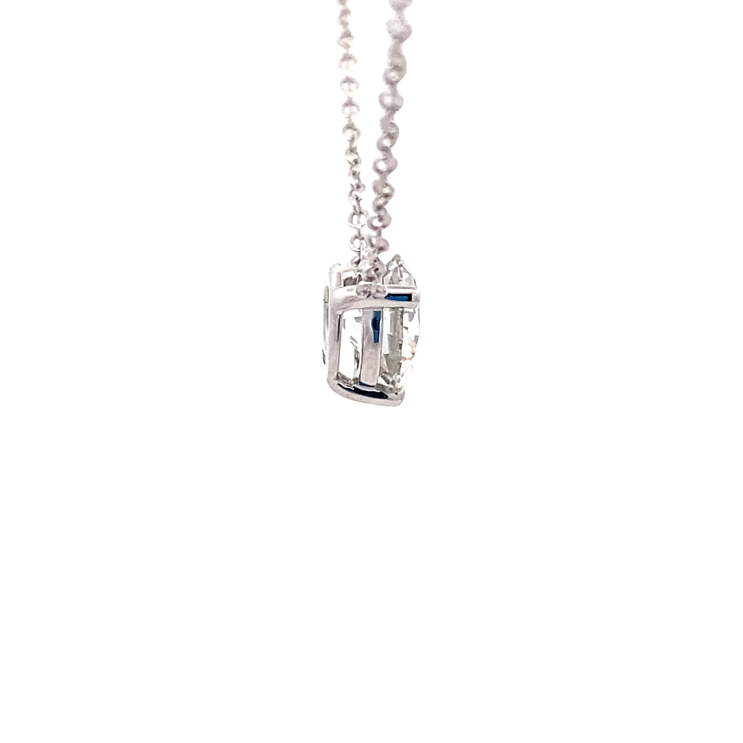 One 14 karat white gold diamond solitaire necklace containing one lab-grown round brilliant-cut diamond weighing 1.06 carats with G color and VS1 clarity in a three-prong setting. The lab grown diamond is laser inscribed with an IGI identification number and measures 6.55mm - 6.57mm diameter X 4.00mm deep. The pendant is fixed on an 18" chain.