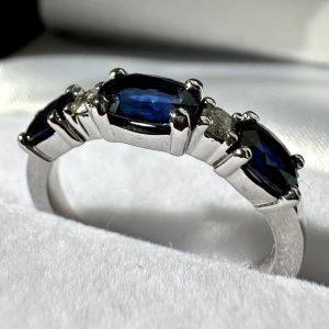 A custom design final product, a sapphire and diamond band