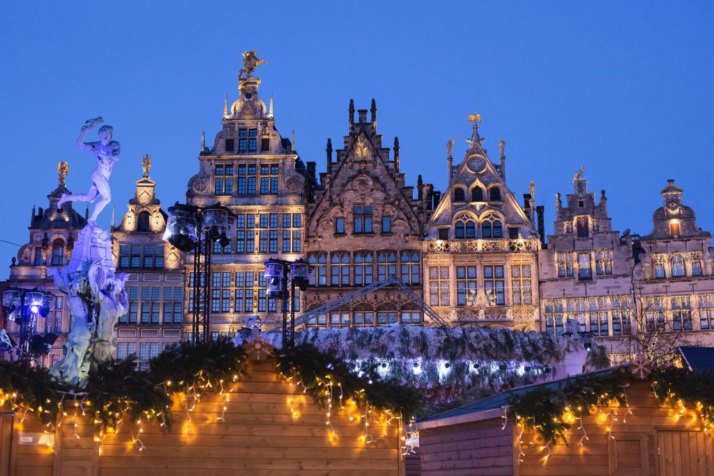 Traditional Christmas market in Europe, Antwerp, Belgium. Main town square with decorated tree and lights – Christmas fair concept.
