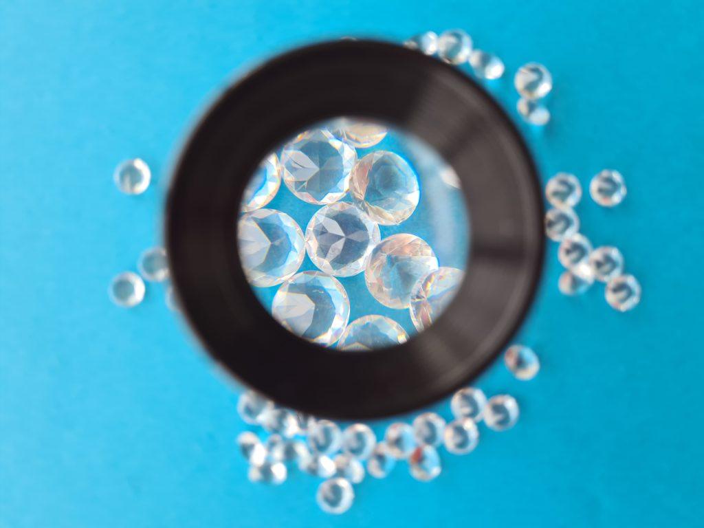 Concept of luxury jewelry through magnifier