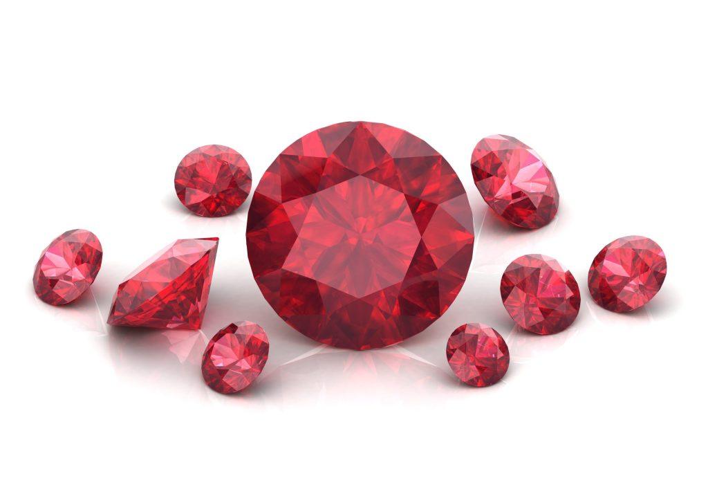 Beautiful loose rubies on a white background , 3D illustration.