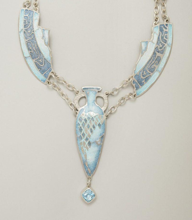 A champleve enamel and blue topaz necklace.